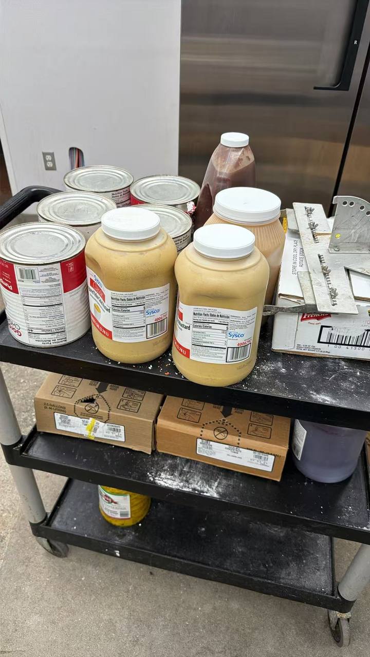 Back-of-house shelving and storage being cleaned and stocked