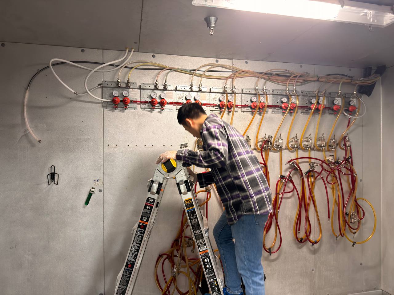 Deep cleaning work continuing inside the walk-in cooler
